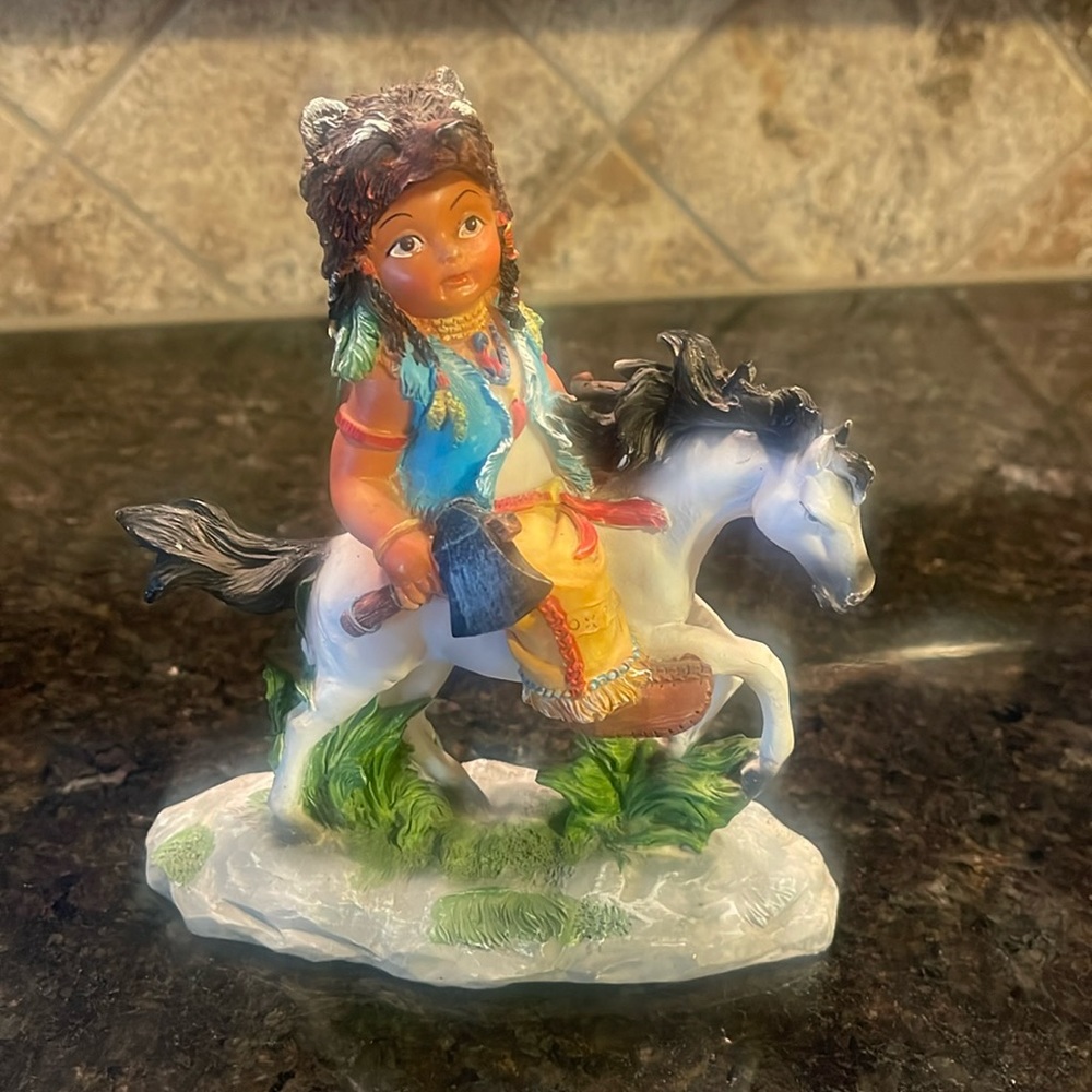 Indian boy on a horse figurine. Hard plastic. Really cute.